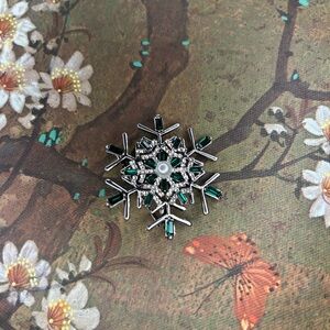 Intricate Silver and Green Snowflake Brooch